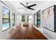 Sunlit dining room featuring a modern table with pool views and stylish design at 1731 Clearwater Harbor Dr, Largo, FL 33770