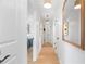 Bright hallway with hardwood floors and decorative accents at 1731 Clearwater Harbor Dr, Largo, FL 33770