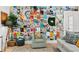 Cozy living room with accent chair, a unique picture collage wall, and stylish decor at 1731 Clearwater Harbor Dr, Largo, FL 33770