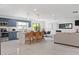 Open-concept living space with kitchen island, dining area and tile floors at 1731 Clearwater Harbor Dr, Largo, FL 33770