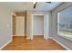 Bedroom with a window, wood-look flooring, and closet at 3414 E 21St Ave, Tampa, FL 33605