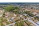 Aerial view showcases the property, pond, outbuildings and outlines property borders at 8279 Sunshine Grove Rd, Brooksville, FL 34613