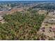 An aerial shot showing the property, outbuildings, and the surrounding landscape with borders at 8279 Sunshine Grove Rd, Brooksville, FL 34613