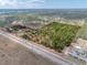 Aerial view showcases the expansive acreage and outlines the property's borders at 8279 Sunshine Grove Rd, Brooksville, FL 34613
