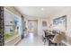 Bright dining room with a large window, contemporary table, and stylish decor that creates a cozy atmosphere at 30918 Silver Stage Dr, Brooksville, FL 34602
