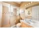 Bright bathroom with a glass shower stall, nautical themed decorations, and a white vanity at 8305 Welsford Rd, Port Charlotte, FL 33981