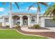 Charming single-story home with an arched entry and meticulously landscaped front yard at 8305 Welsford Rd, Port Charlotte, FL 33981