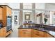 Modern kitchen with stainless steel appliances, custom cabinetry, and an open layout at 8305 Welsford Rd, Port Charlotte, FL 33981