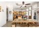 Spacious kitchen and dining area with maple cabinetry, tile floors, and backyard view at 8305 Welsford Rd, Port Charlotte, FL 33981