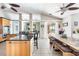 Bright, open kitchen with granite countertops, stainless steel appliances, and dining area with lake view at 8305 Welsford Rd, Port Charlotte, FL 33981
