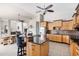 Modern kitchen with maple cabinetry, granite countertops, stainless steel appliances, and tiled backsplash at 8305 Welsford Rd, Port Charlotte, FL 33981