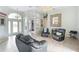 Large living room featuring tile flooring, a ceiling fan and neutral paint at 8305 Welsford Rd, Port Charlotte, FL 33981