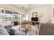 Comfortable living room featuring a cozy seating area with view of the pool at 8305 Welsford Rd, Port Charlotte, FL 33981