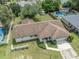 High angle of house with a long driveway and meticulously landscaped yard at 5078 Kenmore St, Spring Hill, FL 34608