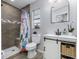 Updated bathroom with tiled shower, modern vanity, and stylish decorative accents at 5078 Kenmore St, Spring Hill, FL 34608