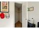 Empty closet with a single shelf is featured in this view from inside the home office at 5078 Kenmore St, Spring Hill, FL 34608