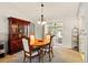 Dining room featuring a wood table, cabinet and natural light from sliding glass doors at 5078 Kenmore St, Spring Hill, FL 34608