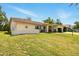 Single story home with well maintained lawn and a quaint covered entryway at 5078 Kenmore St, Spring Hill, FL 34608