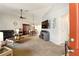 Living room featuring vaulted ceilings, carpet floors, and sliding glass doors at 5078 Kenmore St, Spring Hill, FL 34608