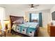 Bedroom with large bed, ceiling fan, and ample natural light at 5078 Kenmore St, Spring Hill, FL 34608