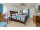 Well-lit main bedroom with large bed, ceiling fan, and a calming ambiance at 5078 Kenmore St, Spring Hill, FL 34608