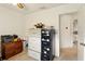 Office area features multiple storage cabinets and a doorway leading to an adjacent bathroom at 5078 Kenmore St, Spring Hill, FL 34608