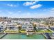 Waterfront homes boast private docks and pools, set against a coastal city skyline at 849 Harbor Is, Clearwater Beach, FL 33767