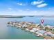 An aerial view showcases the waterfront neighborhood and the serene setting of this coastal home at 849 Harbor Is, Clearwater Beach, FL 33767