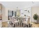 Bright dining room featuring modern decor, stylish lighting, and a glass table for elegant dining at 849 Harbor Is, Clearwater Beach, FL 33767