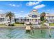 Waterfront home features a private dock, beautiful landscaping and lush green grass at 849 Harbor Is, Clearwater Beach, FL 33767