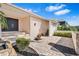 Inviting front entrance with double doors, stone steps, and lush landscaping on a paver driveway at 849 Harbor Is, Clearwater Beach, FL 33767