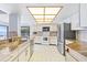Bright kitchen with stainless steel appliances, granite countertops, and ample cabinet space for storage at 849 Harbor Is, Clearwater Beach, FL 33767