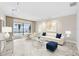 Stylish living room with sleek furniture, modern lighting, and sliding glass doors overlooking the pool and waterfront at 849 Harbor Is, Clearwater Beach, FL 33767