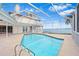 Sparkling pool with screened enclosure and stunning water views at 849 Harbor Is, Clearwater Beach, FL 33767