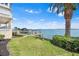 Picturesque waterfront home with a private boat dock and palm trees at 849 Harbor Is, Clearwater Beach, FL 33767
