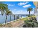 Scenic waterfront property with lush landscaping and private boat dock at 849 Harbor Is, Clearwater Beach, FL 33767