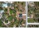 A neighborhood with forest and neatly trimmed lawns at 14183 English Sparrow Rd, Weeki Wachee, FL 34614