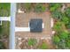 Newly built home with a long driveway surrounded by green trees at 14183 English Sparrow Rd, Weeki Wachee, FL 34614