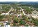 Quiet neighborhood with houses surrounded by trees and connected by roads at 14183 English Sparrow Rd, Weeki Wachee, FL 34614