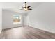 Bedroom featuring a ceiling fan, wood-look flooring and a window for natural light at 14183 English Sparrow Rd, Weeki Wachee, FL 34614