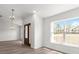 Welcoming entryway features a stained wood door and large window for ample natural light at 14183 English Sparrow Rd, Weeki Wachee, FL 34614