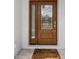 Inviting front door with decorative glass and a 'Welcome to your future home' doormat at 14183 English Sparrow Rd, Weeki Wachee, FL 34614