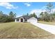 Lovely front exterior, beautiful landscaping, and a wide driveway at 14183 English Sparrow Rd, Weeki Wachee, FL 34614