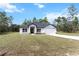 Charming home featuring a well-manicured front yard and inviting entrance at 14183 English Sparrow Rd, Weeki Wachee, FL 34614