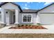 The house has a well-manicured front yard and a beautiful porch at 14183 English Sparrow Rd, Weeki Wachee, FL 34614