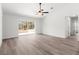 Bright living room with sliding glass doors and neutral walls, creating a serene and inviting atmosphere at 14183 English Sparrow Rd, Weeki Wachee, FL 34614