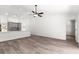 Bright open floor plan offers a spacious living area and kitchen with gray cabinetry at 14183 English Sparrow Rd, Weeki Wachee, FL 34614