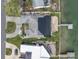 An aerial view of a waterfront home with lush landscaping and a private dock at 193 Mar St, St Pete Beach, FL 33706