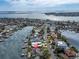 Aerial view of waterfront community with bridge and canal access to the open bay at 193 Mar St, St Pete Beach, FL 33706