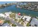 Waterfront single Gathering home featuring a private dock, surrounded by lush landscaping with ocean access at 193 Mar St, St Pete Beach, FL 33706